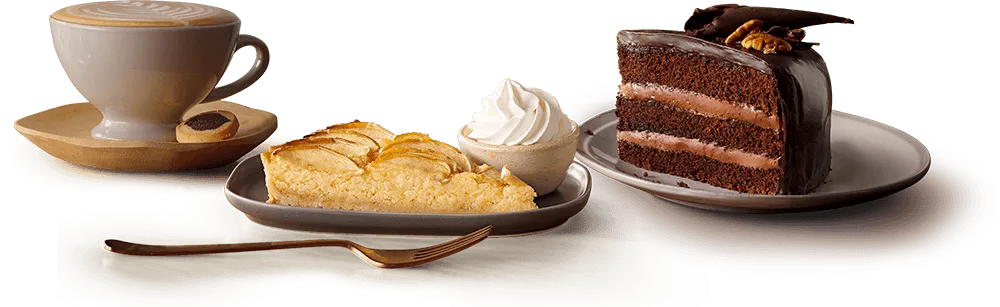 Cappuccino with slices of cake and tart