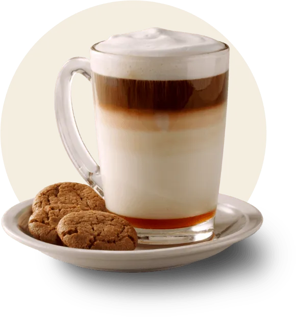 A creamy latte in a clear glass 