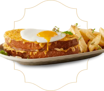 Eggs Benedict with Chips on a serving plate