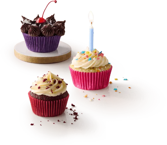 Group of three cupcakes with frosting