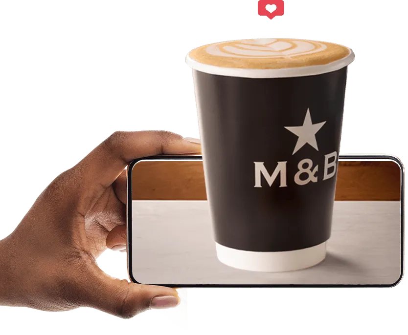 M&B takeaway coffee and person holding phone