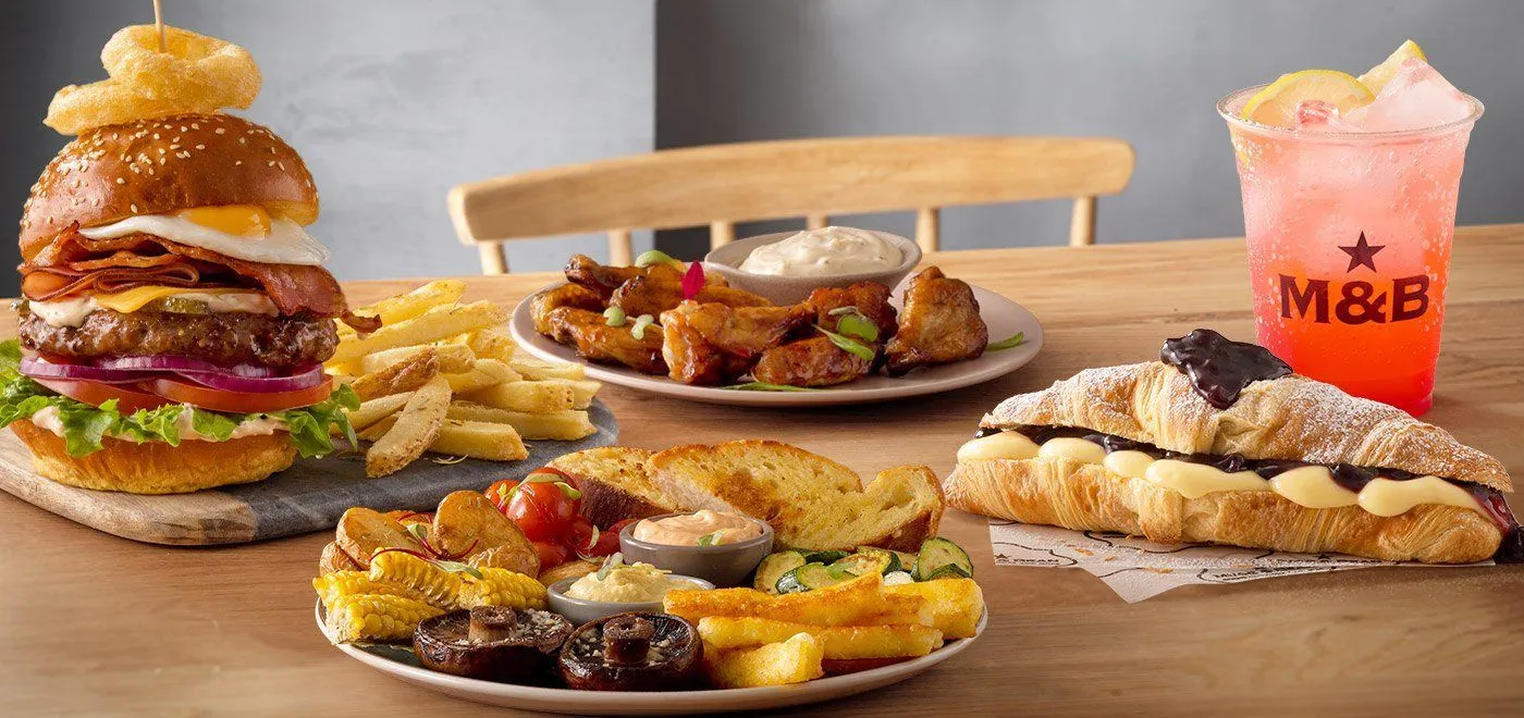 burger breakfast and croissant with lemonade