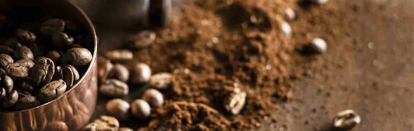 coffee beans and some coffee grounds