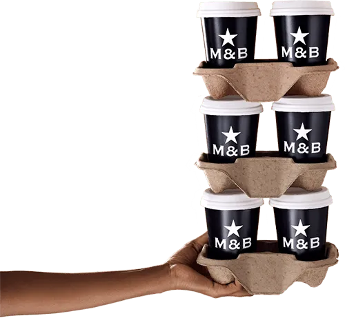 Hand balancing six takeaway coffee cups in holders